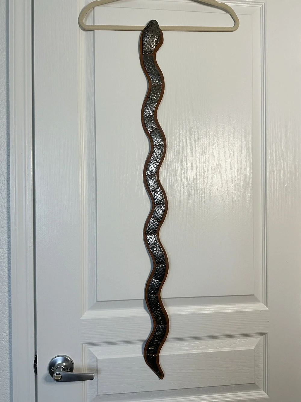 Vintage brown leather and silver colored metal articulated snake belt